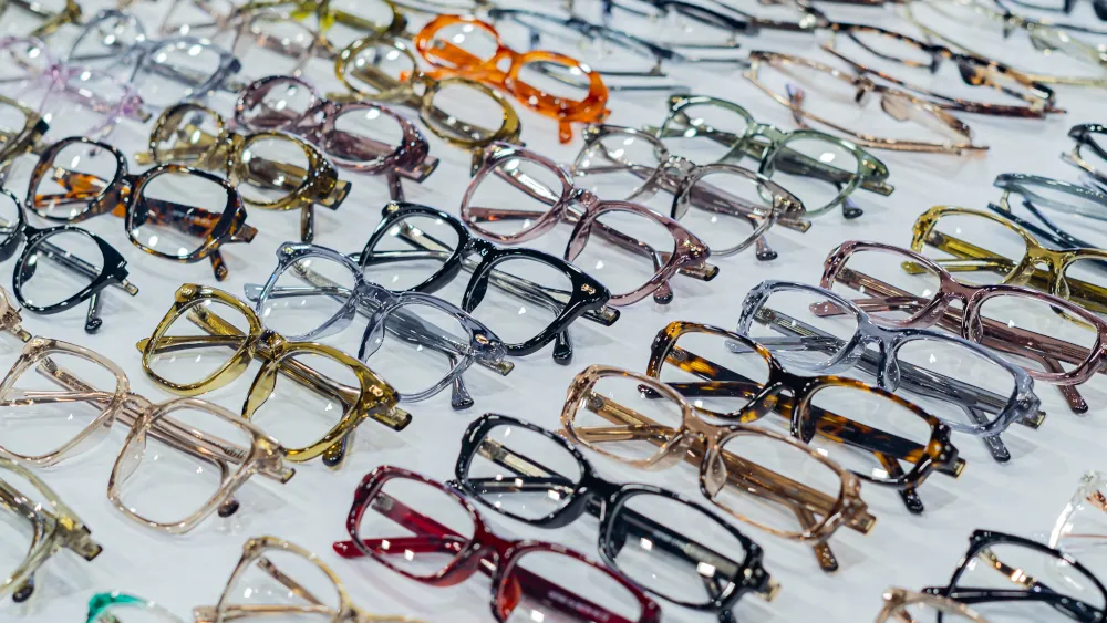 Designer eyeglass frames displayed on a table